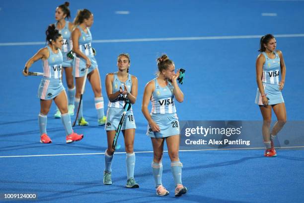 Julieta Jankunas of Argentina and team mates look dejected following defeat during the quarter final game between Australia and Argentina of the FIH...