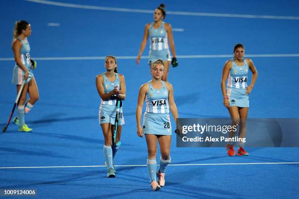 Julieta Jankunas of Argentina and team mates look dejected following defeat during the quarter final game between Australia and Argentina of the FIH...