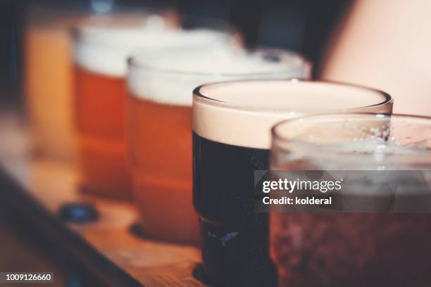 close-up of beer in glasses - bier brauerei stock-fotos und bilder