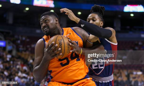 Jason Maxiell of 3's Company battles with Robert Hite of Tri-State during the BIG3 three on three basketball league at Scotiabank Arena on July 27,...