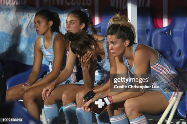 Agustina Albertarrio of Argentina and her team mates look dejected after they lose on a penalty shoot out during the Quarter Final game between...