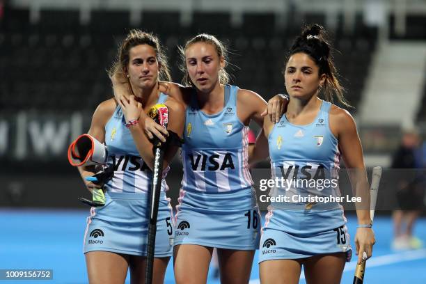 Agostina Alonso of Argentina, Florencia Habif of Argentina and Maria Granatto of Argentina actknowledge their fans as they leave the field looking...