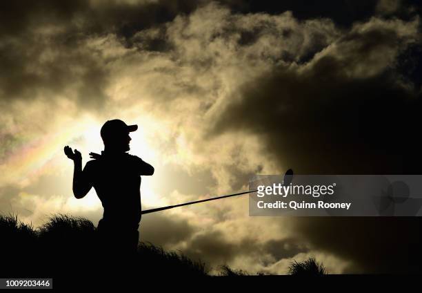 Jake Higginbottom of Australia lose grip of his club as he plays a tee shot during Day One at the Fiji International Golf Tournament on August 2,...