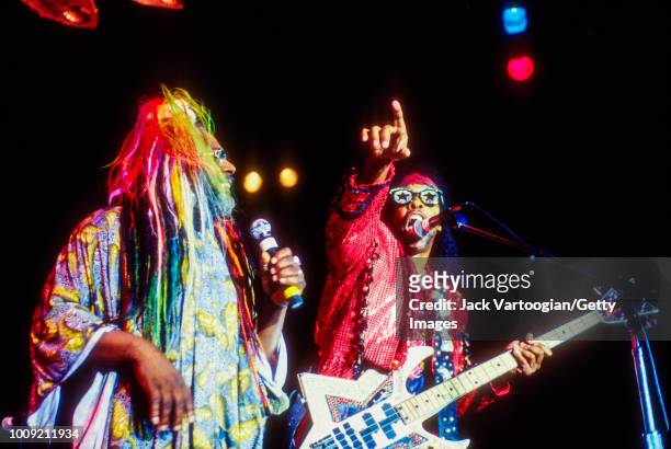 American Rock, Funk, and Soul musician and bandleader George Clinton , along with Bootsy Collins on electric bass, leads his group...