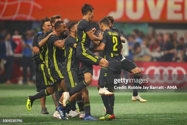 Players of Juventus celebrate winning the penalty shoot out after Mattia De Sciglio of Juventus scores the winning penalty during the 2018 MLS...