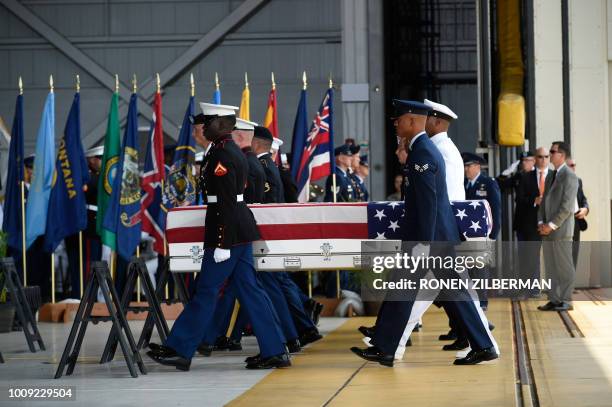 Military pallbearers carry the believed to be remains of U.S. Service members collected in the Democratic People's Republic of Korea during...