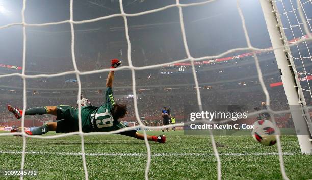 Goalkeeper Mattia Perin of Juventus dives as the penalty kick by Bradley Wright-Phillips of the MLS All-Stars hits the post during the 2018 MLS...