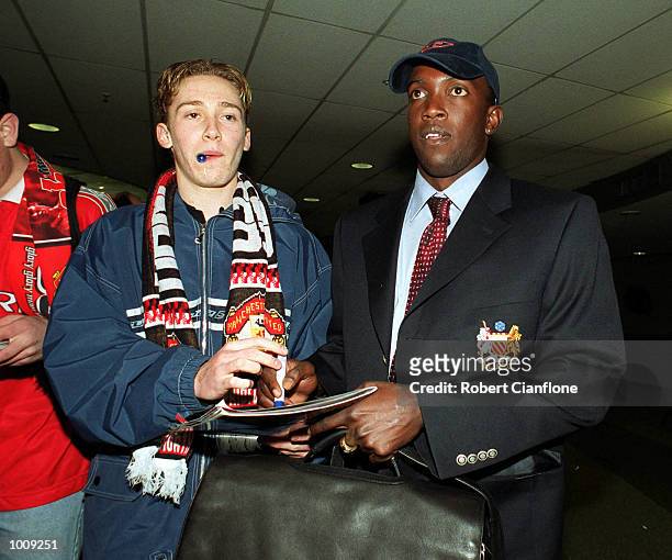 Dwight Yorke of Manchester United, signs an autograph for fans on his arrival with some of his team mates to Melbourne late this evening, for the...