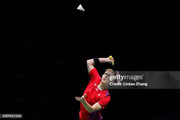 Viktor Axelsen of Denmark hits a shot against Ng Ka Long Angus of Hong Kong in their Men's singles match during the Badminton World Championships at...