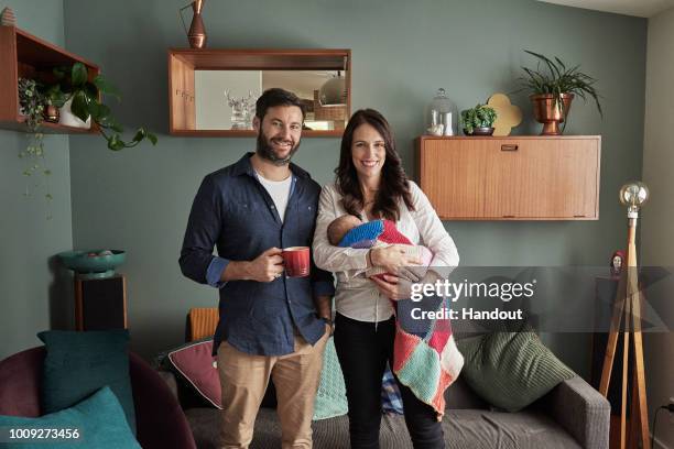 In this handout photo provided by the Office of the Prime Minister of New Zealand, Prime Minister Jacinda Ardern and partner Clarke Gayford pose with...