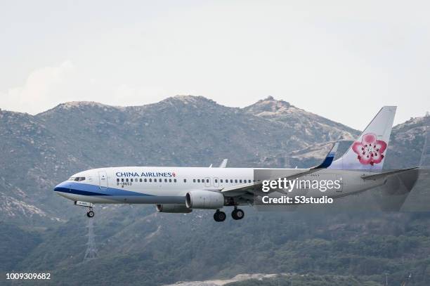 Boeing 737-8Q8 passenger plane belonging to the China Airlines lands at Hong Kong International Airport on August 01 2018 in Hong Kong, Hong Kong.
