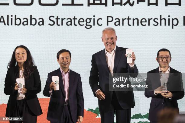 Belinda Wong, chief executive officer of China at Starbucks Corp., from left, Daniel Zhang, chief executive officer of Alibaba Group Holding Ltd.,...