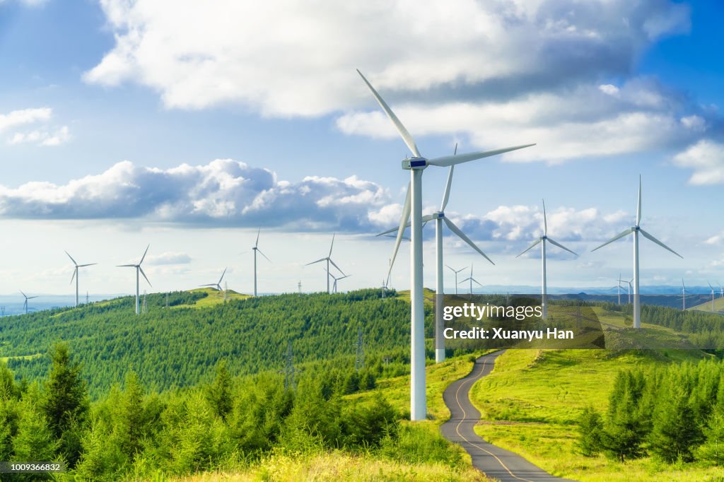 Wind turbine on field in hill