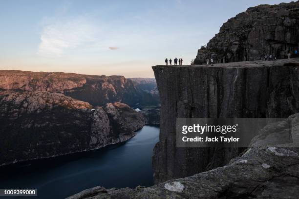 Tourists stand on top of Preikestolen ahead of The 'Mission: Impossible - Fallout' Pulpit Rock Norway Screening on August 01, 2018 in Forsand, Norway.