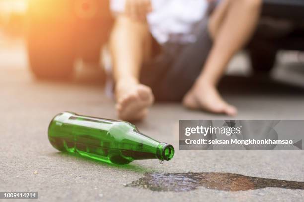 homeless alcoholism drunk man sleeping on the floor - comazuipen stockfoto's en -beelden