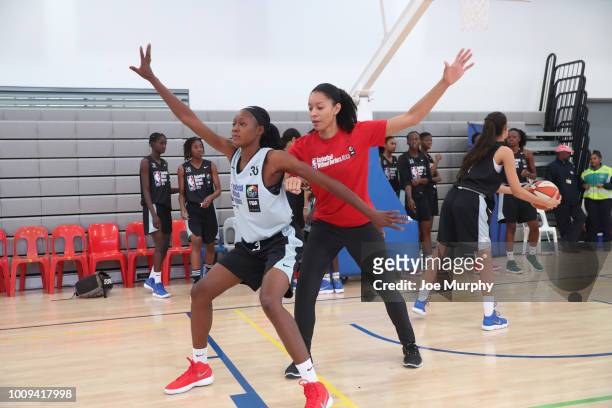 Legend Allison Feaster goes over drills with the campers at the Basketball Without Boarders Africa program at the American International School of...