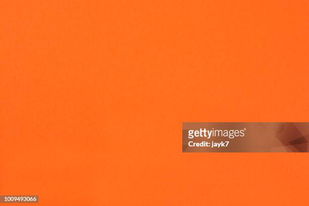 orange colored paper background - fond orange photos et images de collection