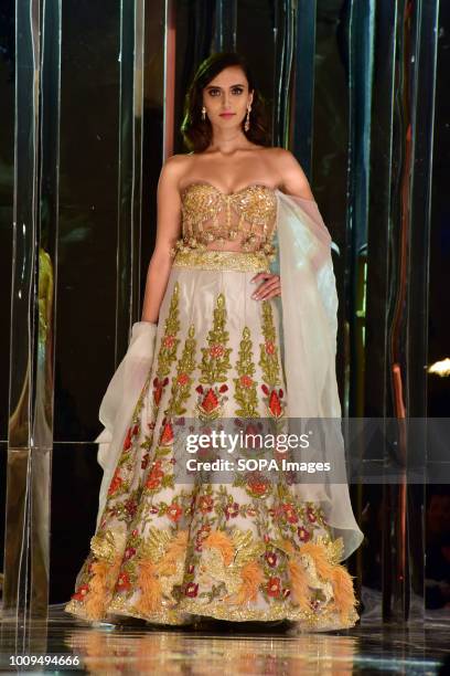 An Indian model displaying collection of designer Manish Malhotra's Haute Couture 2018 fashion show at hotel JW Marriott, Juhu in Mumbai.