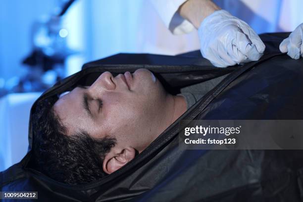medical examiner with corpse in morgue. - man dead body stock pictures, royalty-free photos & images