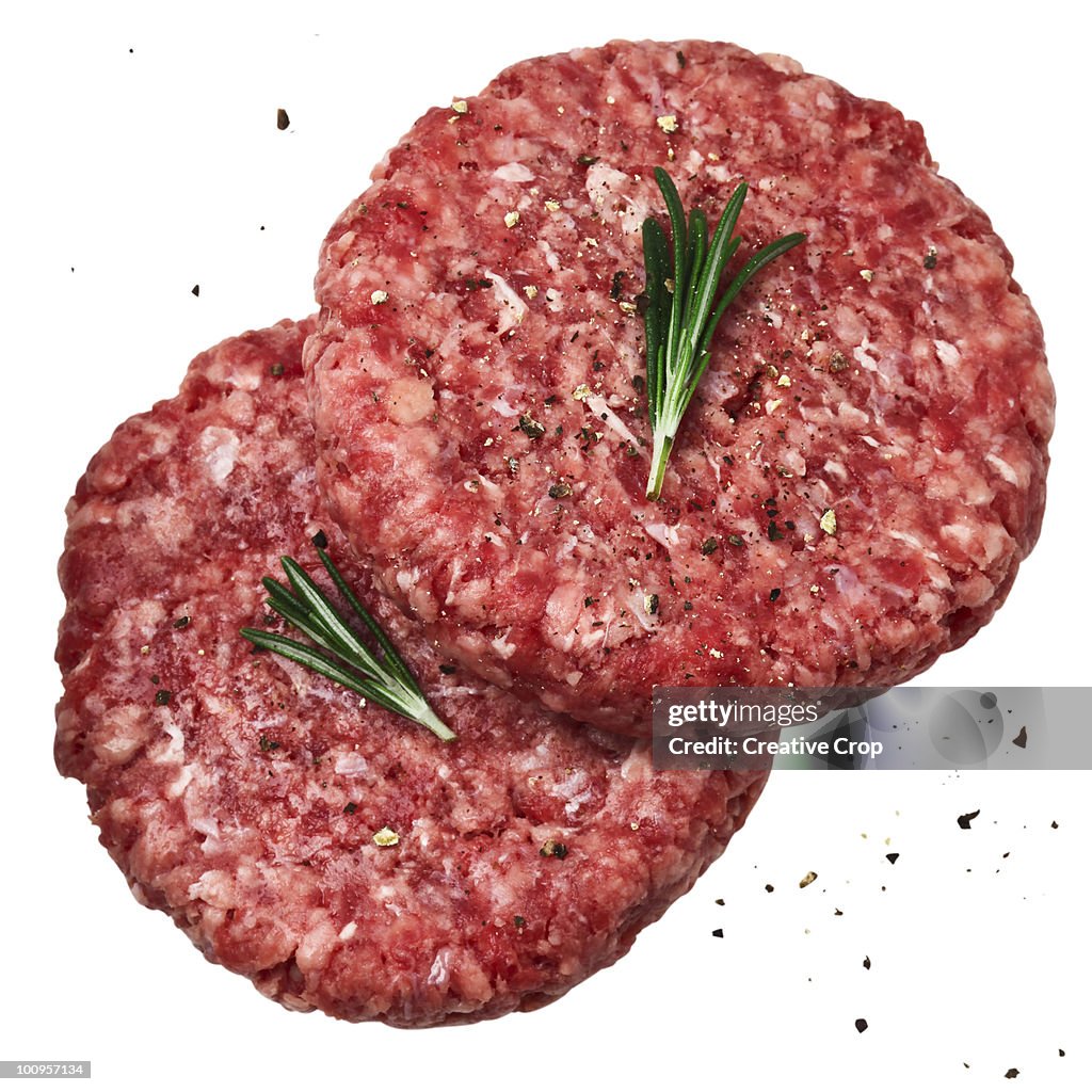 Two raw beef burgers / patty