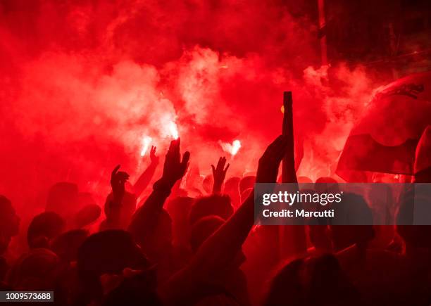 croatian football fans burn a bengal fire - bengalischer feuer stock-fotos und bilder