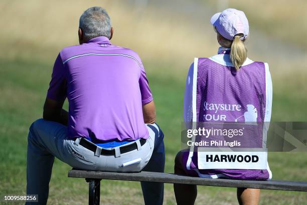 Mike Harwood of Australia and his wife Donna in action during Day One of The Staysure PGA Seniors Championship at The London Club on August 2, 2018...