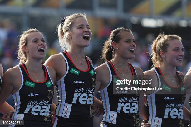 Anne Schroder, Hannah Gablac, Selin Oruz and Nike Lorenz of Germany sing their national anthem during the Quarter Final game between Germany and...