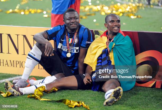 Sulley Muntari and Samuel Eto'o of Inter Milan celebrate after winning the UEFA Champions League Final match between Bayern Munich and Inter Milan at...