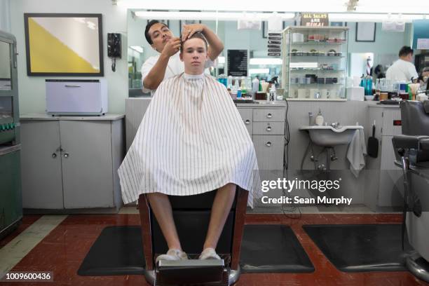 Barber cutting kids hair