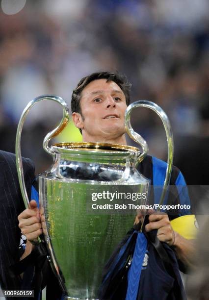 Inter Milan captain Javier Zanetti celebrates with the trophy after winning the UEFA Champions League Final match between Bayern Munich and Inter...