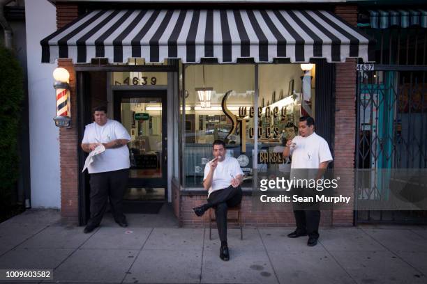 Three barbers hanging out