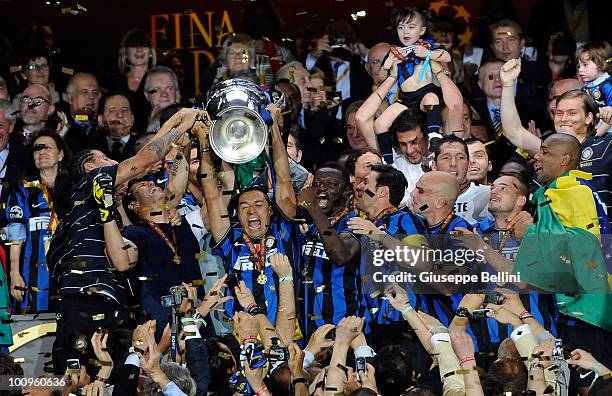Ivan Cordoba of Inter Milan lifts the UEFA Champions League trophy following their team's victory at the end of the UEFA Champions League Final match...