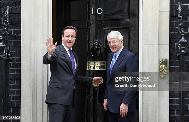 British Prime Minister David Cameron greets former British Prime Minister Sir John Major for talks at 10 Downing Street on May 26, 2010 in London,...