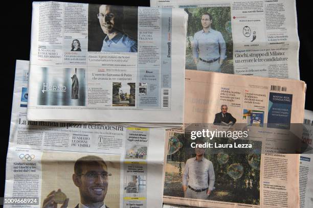 In this photo illustration front covers of Italian newspapers feature news that Italian mathematician Alessio Figalli has been awarded of the Fields...