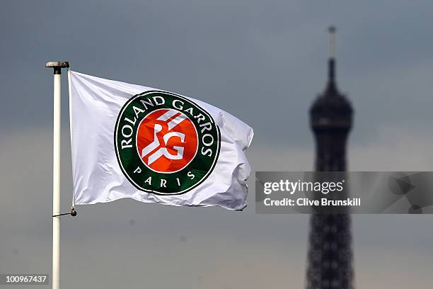 The Eiffel Tower is seen in the background of a flag on day four of the French Open at Roland Garros on May 26, 2010 in Paris, France.