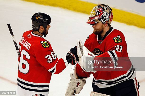 Dave Bolland of the Chicago Blackhawks celebrates with goaltender Antti Niemi in Game Four of the Western Conference Finals during the 2010 NHL...