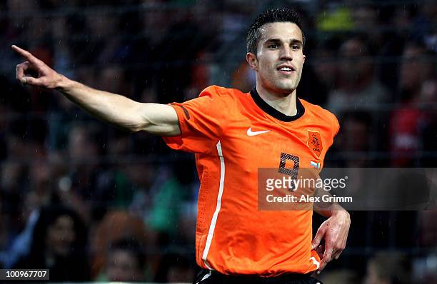 Robin van Persie of the Netherlands celebrates his team's first goal during the international friendly match between the Netherlands and Mexico at...
