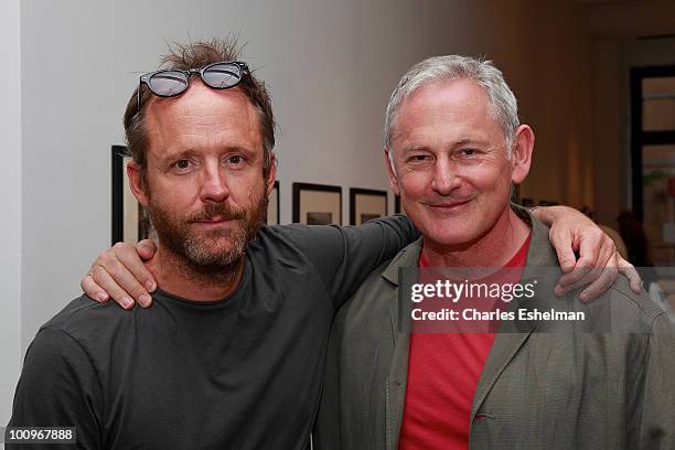 Actors John Benjamin Hickey and Victor Garber attend the photography exhibition opening for "1.3: New Color Images by Joel Grey" at Steven Kasher...