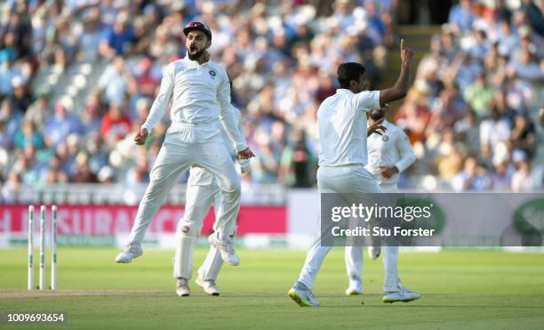 India captain Virat Kohli celebrates with bowler Ravi Ashwin after Ashwin had bowled Alastair Cook during day two of the First Specsavers Test Match...