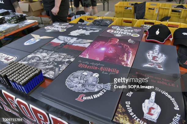 Neo-nazi vinyls, lighters, caps and numerous goods for sale on a stand at the Schild und Schwert festival. Anti-fascists held a counter-rally against...