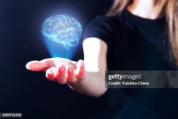 hand showing a brain hologram - genius woman stock pictures, royalty-free photos & images