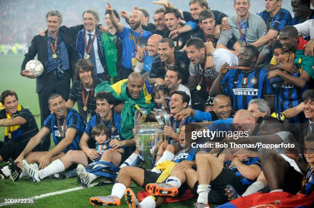 The Inter Milan team celebrate with the trophy, including manager Jose Mourinho and President Massimo Moratti after winning the UEFA Champions League...