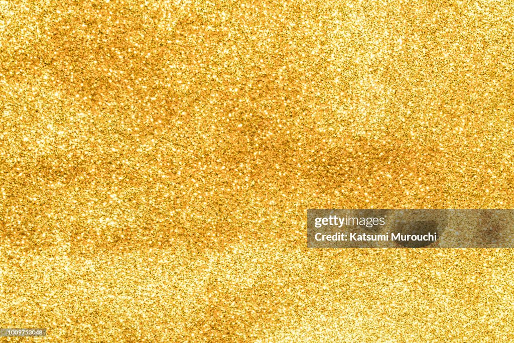 Golden glitter powder texture background