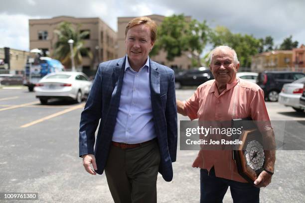 Adam Putnam is greeted by Osvaldo Castellanos as he arrives for a campaign event at the Bay of Pigs Veterans Association Museum as he runs to be the...