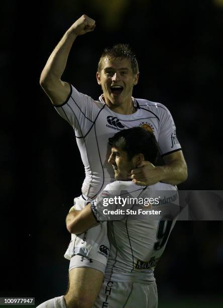 Exeter flyhalf Gareth Steenson is picked up by scrum half Haydn Thomas on the final whistle after the RFU Championship final between Bristol and...