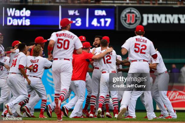 Jose Martinez of the St. Louis Cardinals celebrates with teammates after hitting a walk off two run single during the ninth inning against the...