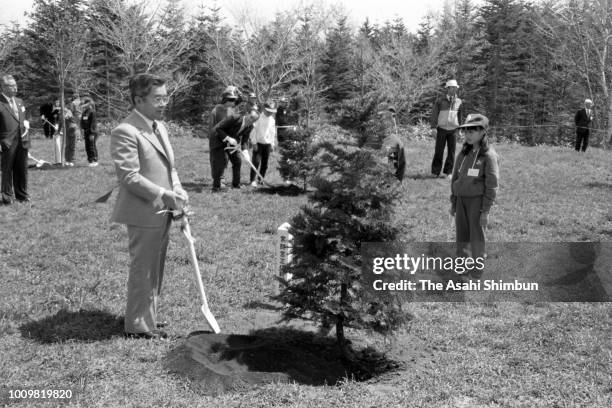 Prince Hitachi plant a memorial tree during the National Wild Birds Preservation Meeting at Nohoro Forest Park on May 12, 1985 in Sapporo, Hokkaido,...