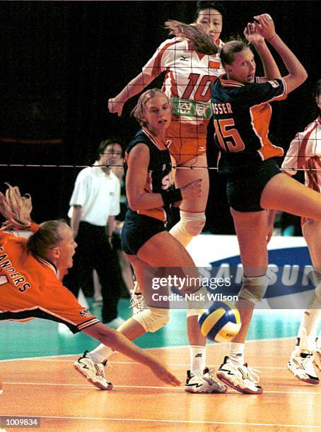 Kitty Sanders of Netherlands tries to keep the ball alive as Ingrid Visser looks on against China during the NSW International Volleyball at the...