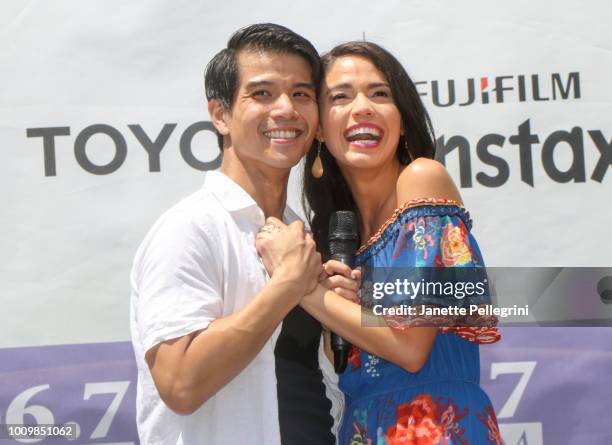 Telly Leung and Arielle Jacobs from the cast of "Aladdin" perform at 106.7 LITE FM's Broadway in Bryant Park on August 2, 2018 in New York City.