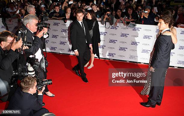 Katie Holmes and Tom Cruise attend the National Movie Awards 2010 at the Royal Festival Hall on May 26, 2010 in London, England.